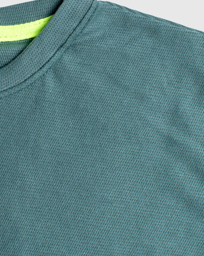 Detalle de tela waffle premium color verde NAVI Kids